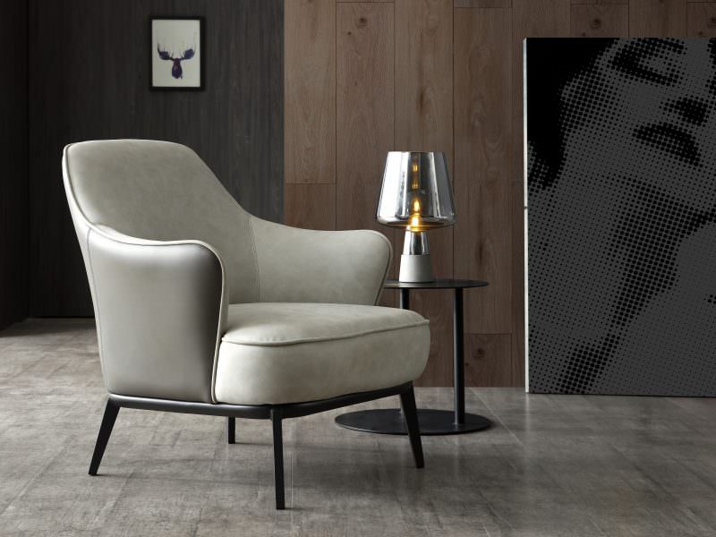 Sunizona Leisure Chair is available in dual material with the front, back and seat being light grey waterproof fabric and the outer back being dark grey faux leather. This dual material accent chair is complimented with a sanded black coated steel frame.